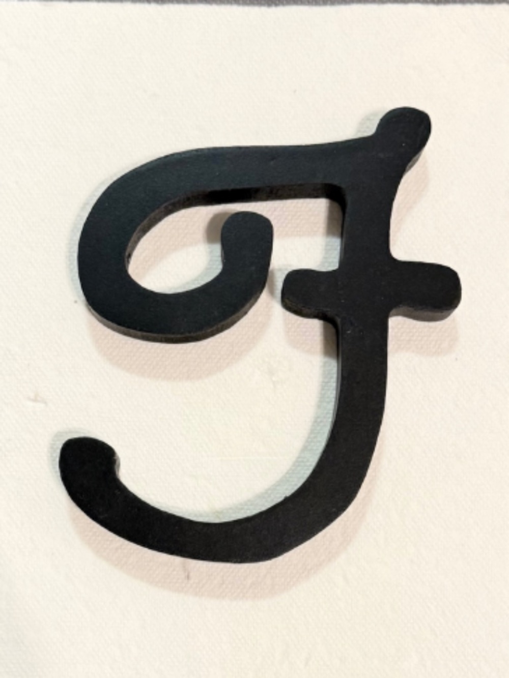 Black Wooden Script Letter "F"